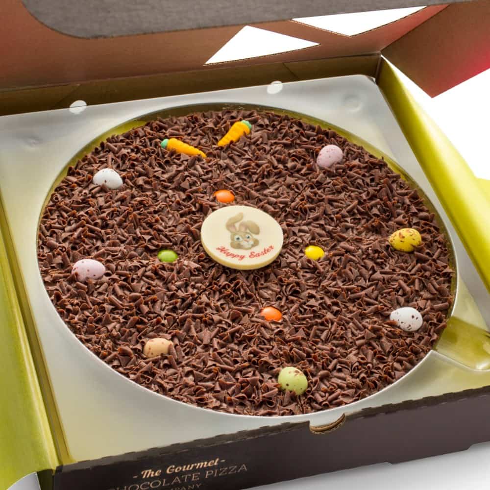 Our 10 inch Easter PIzza is adorned with a Happy Easter Chocolate plaque, orange sugar carrots and candy coated chocolate eggs
